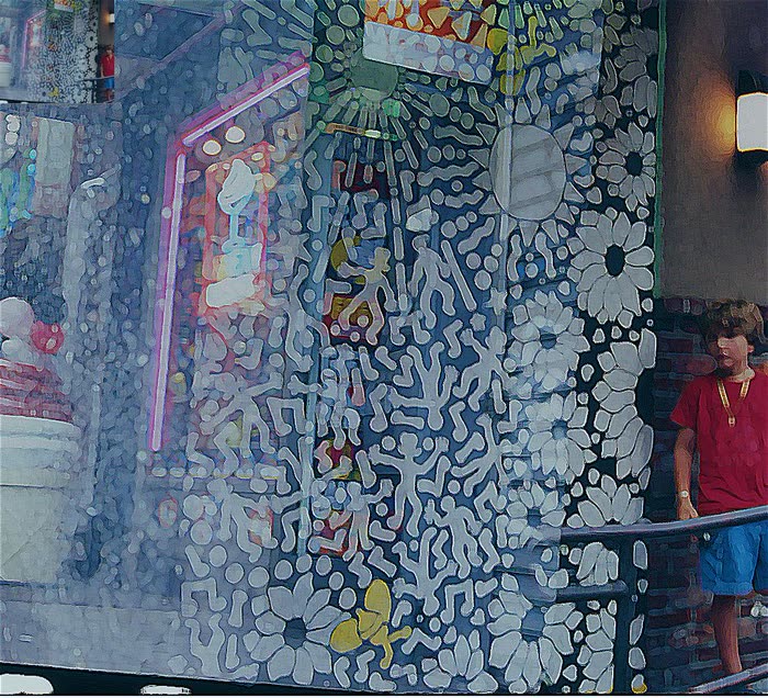 Taller de arte con mural colorido de fondo